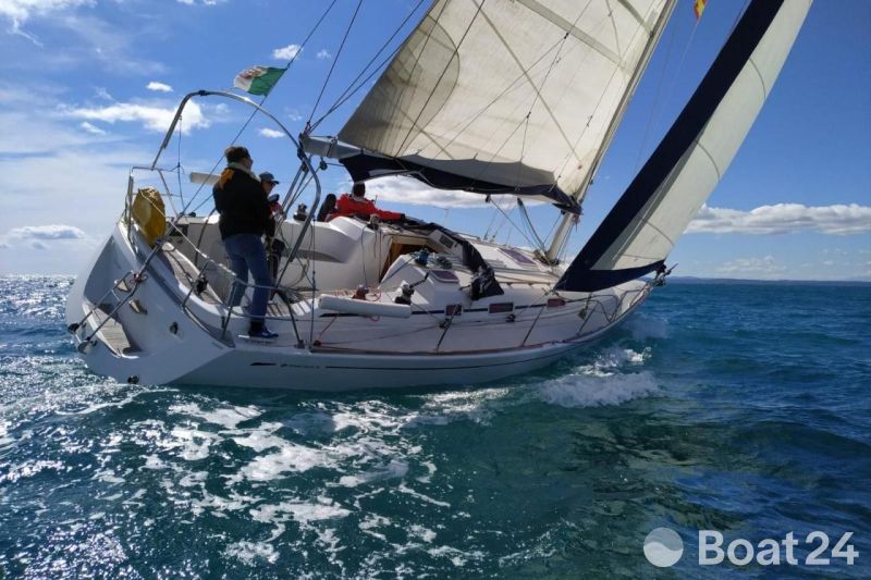 Sailing a 2005 Grand Soleil 40 yacht on open sea under clear skies.