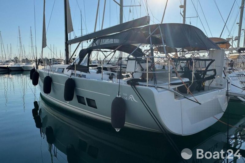 2018 Hanse 588 yacht docked in marina, featuring sleek design and modern amenities.