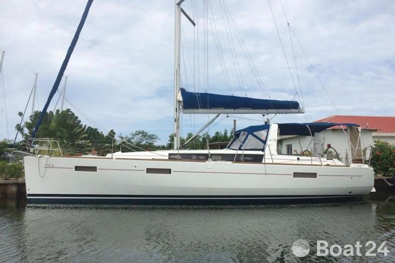2013 Beneteau Oceanis 41 sailboat docked, featuring sleek design and blue sail cover.