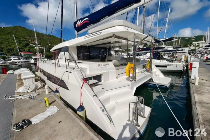 Luxury Leopard 50 catamaran docked at marina, 2021 model, sunny day.