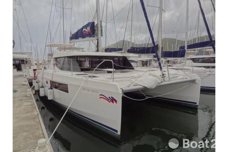 2020 Leopard 45 catamaran docked at marina, featuring sleek design and modern amenities.