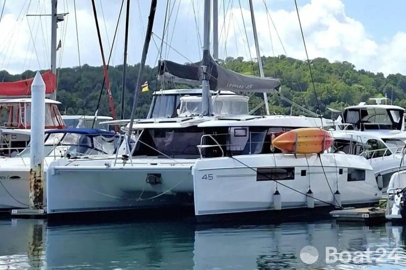 2018 Leopard 45 catamaran docked at marina with kayak on deck.