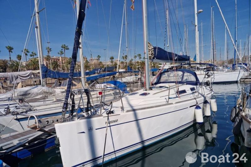 2006 Dufour 40 Performance sailboat docked in a marina under clear blue skies.