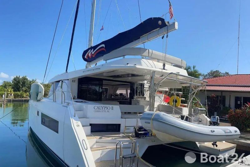 2022 Leopard 45 yacht docked, featuring a sleek design and spacious deck area.