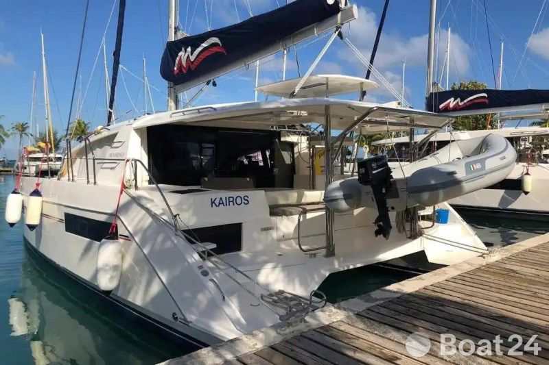 2020 Leopard 40 catamaran docked, featuring a dinghy and spacious deck area.