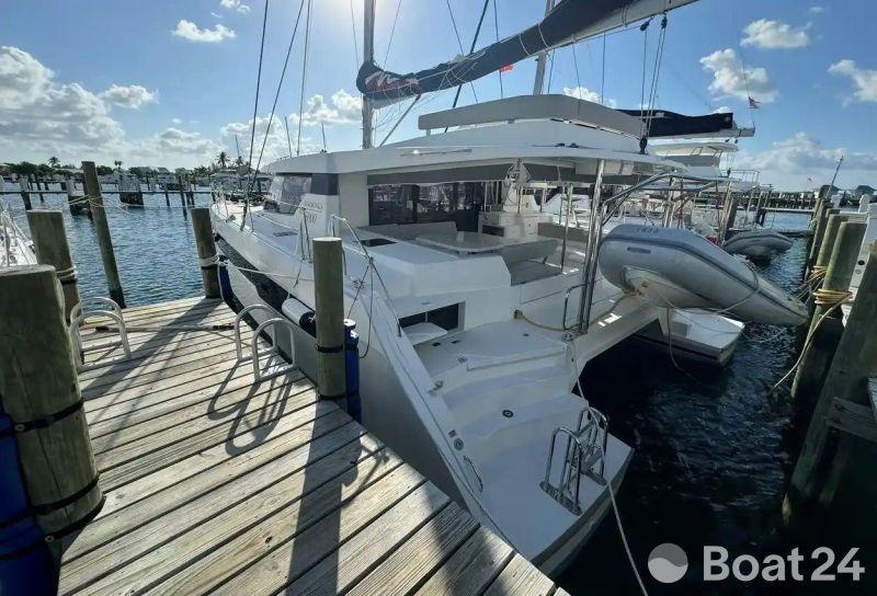 2020 Leopard 50 catamaran docked at marina under sunny skies.