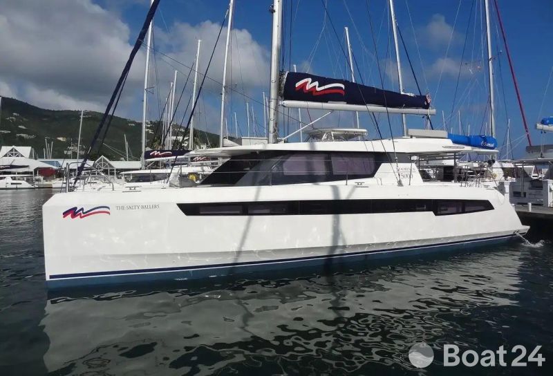 2022 Leopard 50 catamaran docked at a marina with blue sky background.