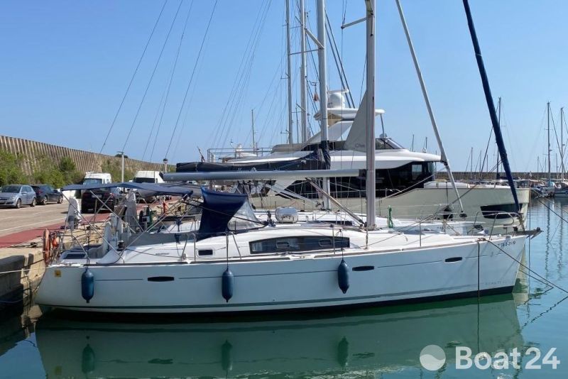 2007 Beneteau Oceanis 40 sailboat docked in a marina under clear blue skies.