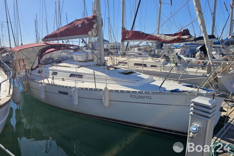 2002 Beneteau Oceanis Clipper 311 sailboat docked in marina, sunny day.