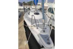 Sasanka Viva 700 sailboat, 2006 model, docked at a marina.