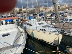 Sailboats docked in a marina, featuring a 1988 Feeling 286 model.