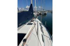 Dufour 40 Performance 2005 sailboat docked in marina, clear sky, calm water.