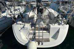 2005 Dufour 40 Performance sailboat docked at marina, rear view.