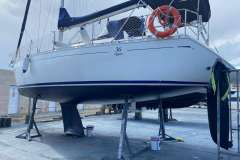 Dufour 36 Classic sailboat from 2000 on dry dock, undergoing maintenance.