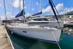 2016 Jeanneau Sun Odyssey 509 sailboat docked in marina under blue sky.
