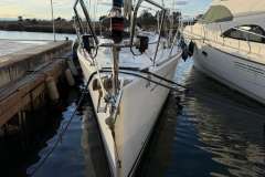 2005 Grand Soleil 40 yacht docked at marina, side view.