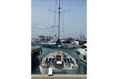 Nautor Swan 48 yacht, 2022 model, docked in a marina with other boats.