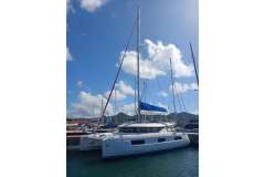 2020 Lagoon 46 catamaran docked under a clear blue sky.