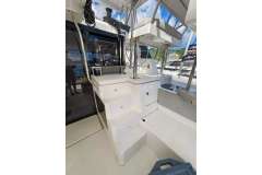 2021 Leopard 50 yacht interior with stairs and seating area, featuring modern design.