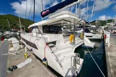Luxury Leopard 50 catamaran docked at marina, 2021 model, sunny day.