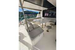 Luxurious Leopard 50 yacht interior with seating and table, 2021 model, scenic water view.