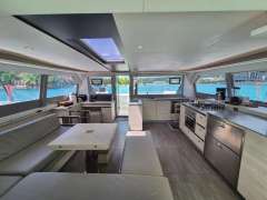 Luxurious interior of a 2020 Leopard 50 yacht with modern kitchen and scenic ocean views.