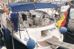 Sailing yacht Bavaria 44, 2002 model, docked with blue canopy and German flag.