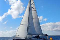 Sailing yacht Hanse 315 from 2006 on open sea under blue sky.