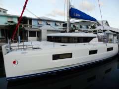2020 Lagoon 46 catamaran docked at marina, featuring sleek design and modern architecture.
