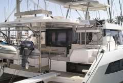 2022 Leopard 42 yacht with dinghy, docked in a marina.