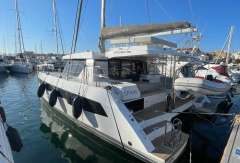 2022 Leopard 42 catamaran docked in marina, sunny day, clear blue sky.