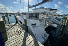 2020 Leopard 50 catamaran docked at marina under sunny skies.