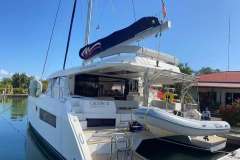 2022 Leopard 45 yacht docked, featuring a sleek design and spacious deck area.