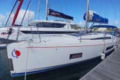 2024 Beneteau Oceanis 461 sailboat docked at marina, featuring sleek design and modern amenities.