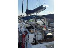 2017 Beneteau Oceanis 48 sailboat cockpit with steering wheel and canopy.