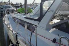2017 Beneteau Oceanis 48 sailboat docked at marina, side view.