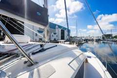 2016 Leopard 40 catamaran docked at a marina under a clear blue sky.
