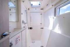 Modern bathroom interior on 2016 Leopard 40 yacht, featuring sleek design and natural lighting.