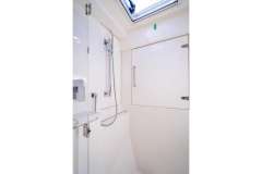 Modern shower area in a 2016 Leopard 40 yacht, featuring sleek fixtures and a skylight.