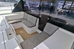 2018 Leopard 45 yacht interior with cushioned seating and sleek design.