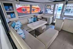 Luxurious interior of 2018 Leopard 45 catamaran with modern seating and vibrant decor.
