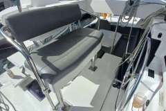 Helm station of 2022 Leopard 45 catamaran with dual steering wheels and seating.