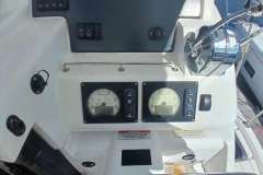 Control panel of a 2022 Leopard 45 yacht with gauges and throttle.