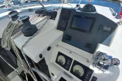 Control panel of a 2022 Leopard 45 yacht with navigation instruments and ropes.