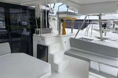 Modern 2022 Leopard 45 yacht interior with seating, steering wheel, and sleek design.
