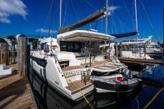 Luxury Leopard 46 catamaran docked at marina, 2025 model, with inflatable dinghy attached.