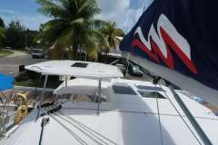 2019 Leopard 40 catamaran docked, featuring sails and tropical surroundings.