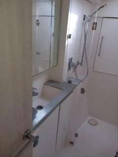 Modern bathroom in 2019 Leopard 40 yacht with shower and sleek fixtures.