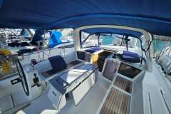 2019 Beneteau Oceanis 41.1 yacht cockpit with blue canopy and seating.