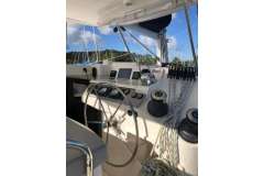 Helm of 2020 Leopard 40 catamaran with steering wheel and navigation equipment.
